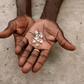 A diamond dealer from Zimbabwe displays diamonds for sale in Manica, near the border with Zimbabwe, September 19, 2010. REUTERS/Goran Tomasevic
