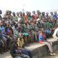 Homeless persons gather to watch a local wrestling match