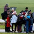 Migrants rest after crossing the Austrian-German border in Wegscheid near Passau, Germany, October 20, 2015.