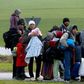 Migrants rest after crossing the Austrian-German border in Wegscheid near Passau, Germany, October 20, 2015.