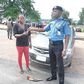 The CP handing over the recovered car to the owner