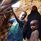 An internally displaced family stands inside their makeshift shelter structure at the Qansahaley settlement camp in Dollow town along the Somalia-Ethiopia border, August 30, 2011.  REUTERS/Thomas Mukoya