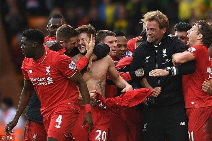Jurgen Klopp and Liverpool Players  celebrate their late winner against Norwich on Saturday, January 23