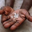 An illegal diamond dealer from Zimbabwe displays diamonds for sale in Manica, near the border with Zimbabwe, September 19, 2010. REUTERS/Goran Tomasevic