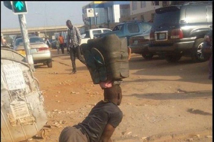 The crippled shoe maker going about his business