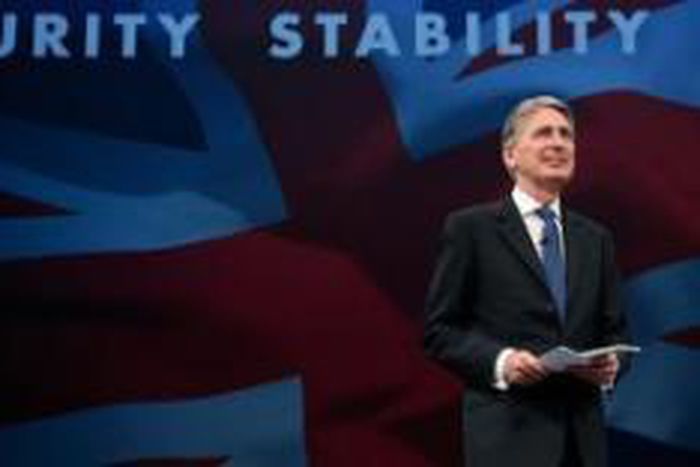 Britain says Syria's Assad must go 'at some point'