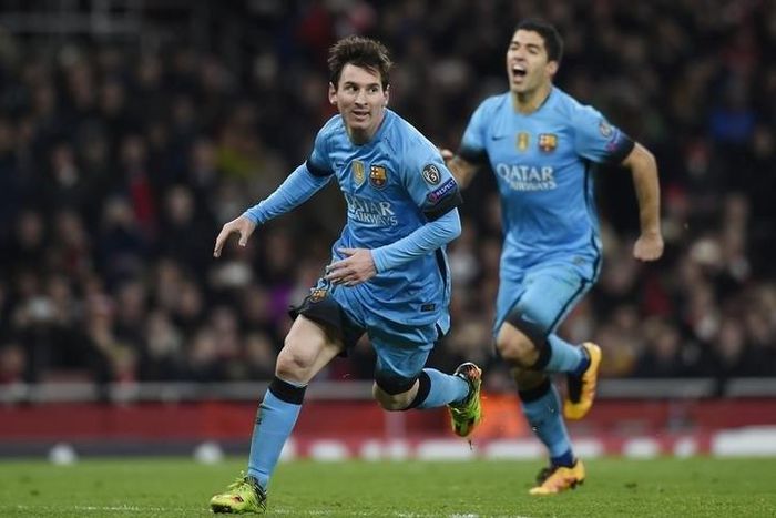 Lionel Messi celebrates scoring the second goal for Barcelona