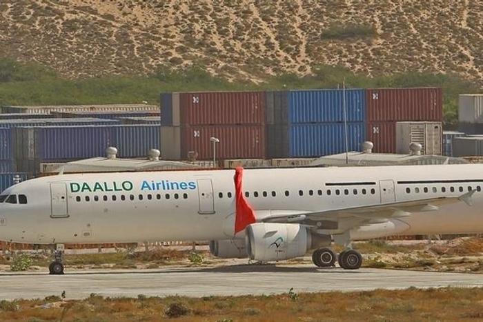 An aircraft belonging to Daallo Airlines is parked at the Aden Abdulle international airport after making an emergency landing following an explosion inside the plane in Somalia's capital Mogadishu, February 3, 2016. REUTERS/Feisal Omar