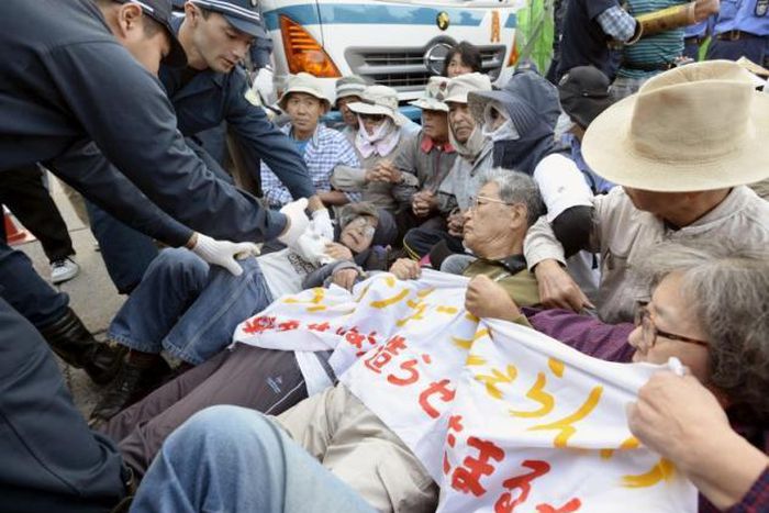 Japanese protesters dragged away as work resumes at U.S. airbase