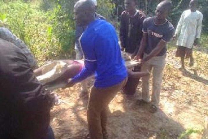 Headless body being taken away