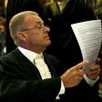 Prosecutor Gerrie Nel reads a document before an appeal by state prosecutors against South African paralympian Oscar Pistorius's conviction last year at the Supreme Court of Appeal (SCA) in Bloemfontein, November 3, 2015. REUTERS/Siphiwe Sibeko