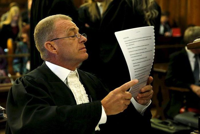 Prosecutor Gerrie Nel reads a document before an appeal by state prosecutors against South African paralympian Oscar Pistorius's conviction last year at the Supreme Court of Appeal (SCA) in Bloemfontein, November 3, 2015. REUTERS/Siphiwe Sibeko