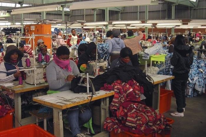 Worker at a clothing factory at an industrial town of Newcastle, 260 km (162 miles) southeast of Johannesburg May 8, 2013. REUTERS/Jon Herskovitz