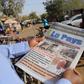 A man reads newspaper headlines that talk about the al Qaeda attack on the Splendid Hotel and Cappuccino that killed at least 28 people from at least seven countries in Ouagadougou, Burkina Faso, January 18, 2016. REUTERS/Joe Penney