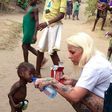 Pictures show woman rescue a 2-yr-old boy accused of being a witch in Nigeria