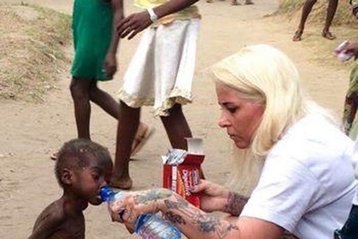 Pictures show woman rescue a 2-yr-old boy accused of being a witch in Nigeria