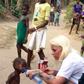 Pictures show woman rescue a 2-yr-old boy accused of being a witch in Nigeria