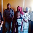 Assana in the middle and her brother second left standing with other suspects