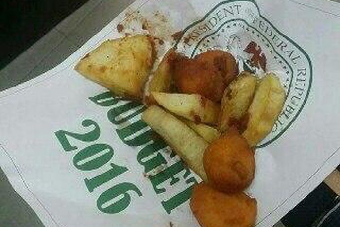 A photo showing a supposed page of Nigeria's 2016 budget being used to sell food