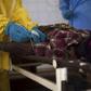 Medical staff take a blood sample from a suspected Ebola patient at the government hospital in Kenema, July 10, 2014. REUTERS/Tommy Trenchard