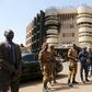 Soldiers stand guard in front of the Splendid Hotel after an attack on the hotel and a restaurant in Ouagadougou, Burkina Faso, January 18, 2016. REUTERS/Joe Penney