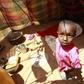 A displaced child stands inside their makeshift shelter structure at the Qansahaley settlement camp in Dollow town, along the Somalia-Ethiopia border, August 30, 2011. REUTERS/Thomas Mukoya
