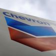 A Chevron gas station sign is pictured at one of their retain gas stations in Cardiff, California October 9, 2013. REUTERS/Mike Blake