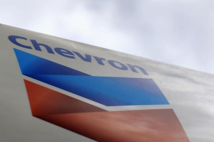 A Chevron gas station sign is pictured at one of their retain gas stations in Cardiff, California October 9, 2013. REUTERS/Mike Blake