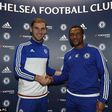 Branislav Ivanovic with Chelsea technical director, Michael Emenalo after signing a new deal