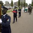 Ivory Coast soldiers carry the portrait and coffin of Robert Guei, former president and army general, during a funeral procession held at the Ivorian Army Chief of Staff headquarters in Abidjan in a file photo. REUTERS/Thierry Gouegnon