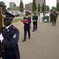 Ivory Coast soldiers carry the portrait and coffin of Robert Guei, former president and army general, during a funeral procession held at the Ivorian Army Chief of Staff headquarters in Abidjan in a file photo. REUTERS/Thierry Gouegnon