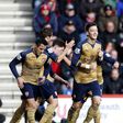Mesut Ozil and Alexis Sanchez celebrate Arsenal goal against Bournemouth on 7/02/2016