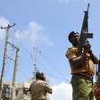 Police hold their positions outside the Masjid Mussa mosque as they attempt to suppress demonstrators reacting to the killing of an Islamic cleric at Kenya's coastal city of Mombasa October 4, 2013. REUTERS/Joseph Okanga