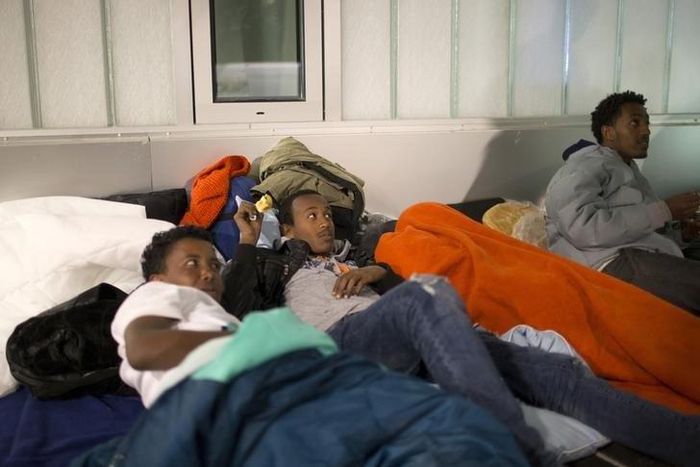 Refugees from Eritrea wait outside Berlin's central registration center for registration which will continue in two days in Berlin, October 3, 2015. REUTERS/Axel Schmidt