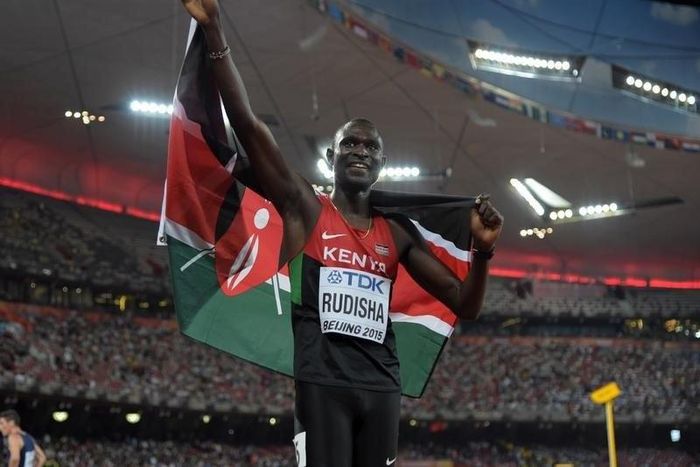David Rudisha (KEN) takes a victory lap with Kenyan flag after winning the 800m in 1:45.84 during the IAAF World Championships in Athletics at National Stadium. Mandatory Credit: Kirby Lee-USA TODAY Sports