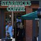 Customers visit a local Starbucks coffee shop in Del Mar, California November 13, 2013. REUTERS/Mike Blake