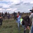 Hungarian TV journalist fired for tripping up fleeing migrants