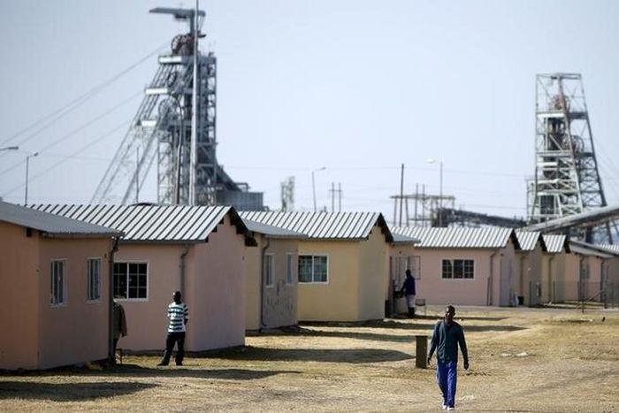 Workers are seen at a hostel next to Lonmin's Karee mine, outside Rustenburg, northwest of Johannesburg July 29, 2015. REUTERS/Siphiwe Sibeko