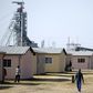 Workers are seen at a hostel next to Lonmin's Karee mine, outside Rustenburg, northwest of Johannesburg July 29, 2015. REUTERS/Siphiwe Sibeko