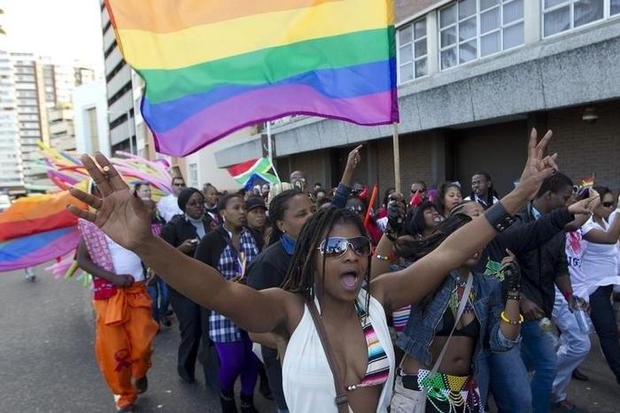 A file photo of a woman holding her hands up during the Durban Pride parade where several hundred people marched through the Durban city centre in support of gay rights. REUTERS/Rogan Ward
