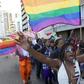 A file photo of a woman holding her hands up during the Durban Pride parade where several hundred people marched through the Durban city centre in support of gay rights. REUTERS/Rogan Ward
