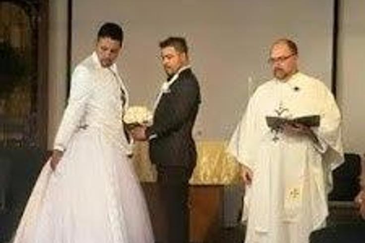 Groom wears dress train on suit for gay wedding