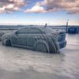 Freezing temperatures transform parked car into ice sculpture