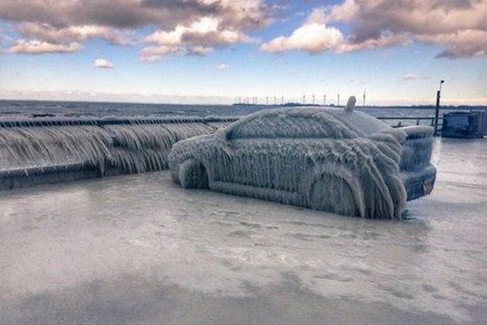 Freezing temperatures transform parked car into ice sculpture