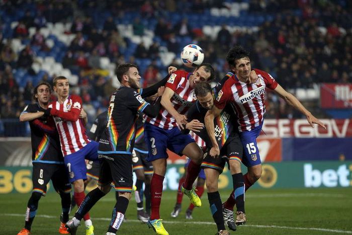 Spain King's Cup- Vicente Calderon stadium, Madrid, Spain - 14/1/16 Atletico Madrid's Diego Godin and Stefan Savic in action with Rayo Vallecano's Joaquin Jose Marin "Quini" and Jose Ignacio Martinez "Nacho". REUTERS/Susana Vera