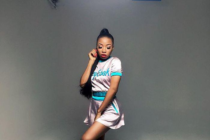 Mo'Cheddah in a look by Clan for one of her music videos