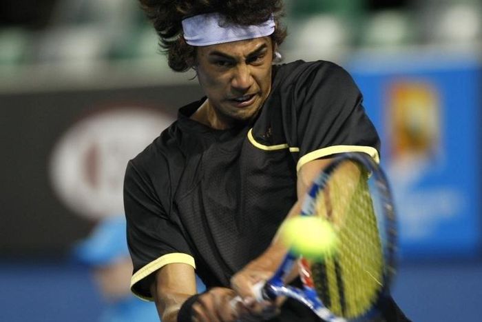 Australia's Nick Lindahl returns a shot against Finland's Jarkko Nieminen at the Australian Open tennis tournament in Melbourne January 18, 2010. REUTERS/Daniel Munoz