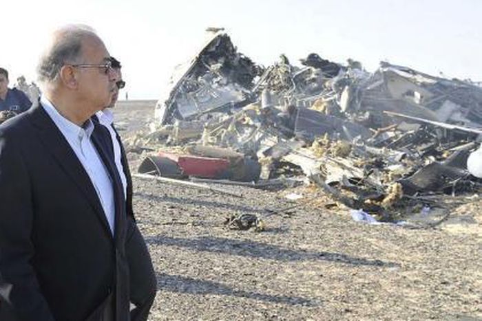 Egypt"s Prime Minister Sherif Ismail looks at the remains of a Russian airliner after it crashed in central Sinai near El Arish city, north Egypt, October 31, 2015.