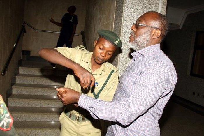 Olisa Metuh appears in an Abuja court in handcuffs on January 25, 2016