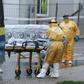 Medical workers in protective clothing arrive at Meixoeiro Hospital, transporting, according to local authorities, a possible new Ebola patient, in Vigo, Spain, October 28, 2015. REUTERS/Stringer